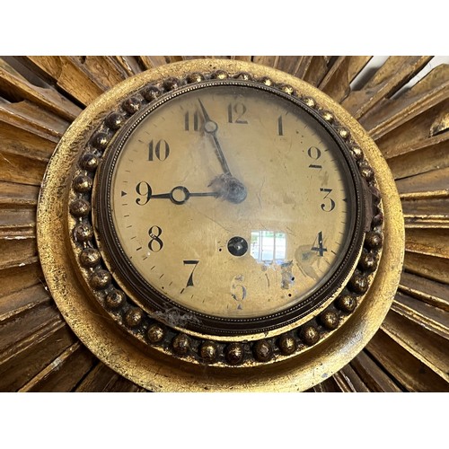 55 - Sunburst wall clock 80 cm wide.

This lot is collection only