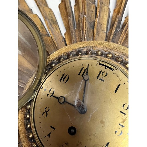 55 - Sunburst wall clock 80 cm wide.

This lot is collection only