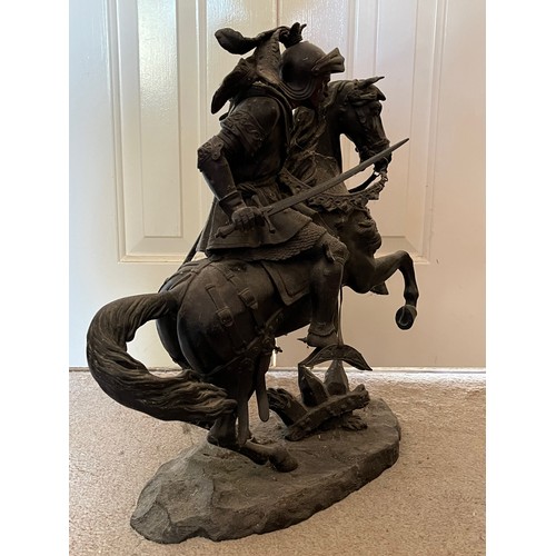 60 - A bronzed cast figure of a mounted knight, 52 cm high.

This lot is collection only