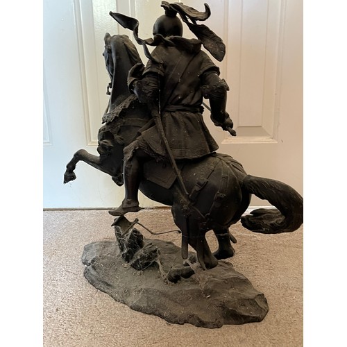 60 - A bronzed cast figure of a mounted knight, 52 cm high.

This lot is collection only