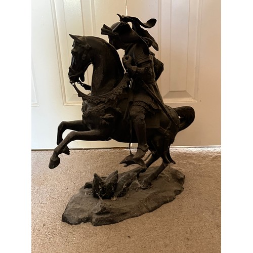 60 - A bronzed cast figure of a mounted knight, 52 cm high.

This lot is collection only