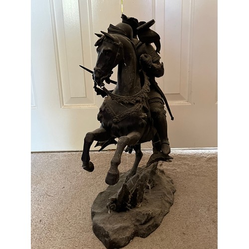 60 - A bronzed cast figure of a mounted knight, 52 cm high.

This lot is collection only