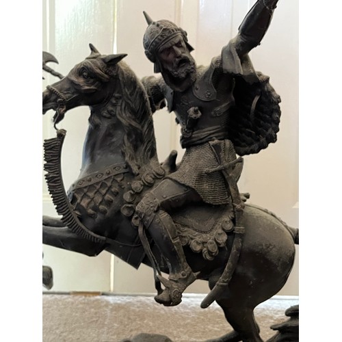 61 - A bronzed cast figure of a Saracen and his charger, 54 cm high.

This lot is collection only