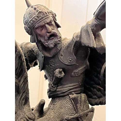 61 - A bronzed cast figure of a Saracen and his charger, 54 cm high.

This lot is collection only