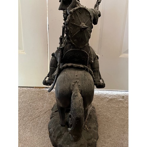 61 - A bronzed cast figure of a Saracen and his charger, 54 cm high.

This lot is collection only