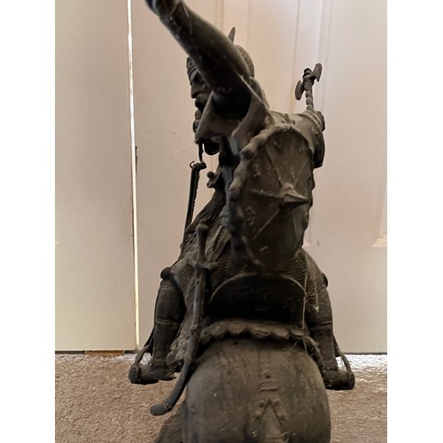 61 - A bronzed cast figure of a Saracen and his charger, 54 cm high.

This lot is collection only