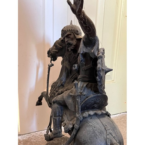 61 - A bronzed cast figure of a Saracen and his charger, 54 cm high.

This lot is collection only