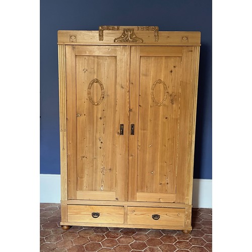 65 - Scandinavian furniture, a Norwegian pine wardrobe early C20th, 121 cm wide x 60 cm deep 185 cm high.... 