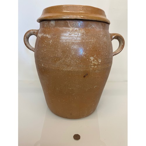 69 - A large stoneware lidded storage jar, ideal for planting up, 31 cm dia and 41 cm high without the li... 