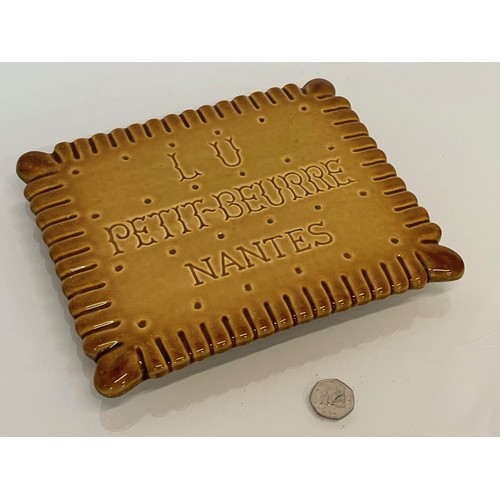 75 - Ceramic advertising French biscuit shaped promotional platter 25 cm x 20 cm.

This lot is available ... 