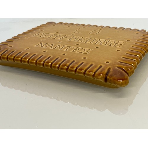 75 - Ceramic advertising French biscuit shaped promotional platter 25 cm x 20 cm.

This lot is available ... 