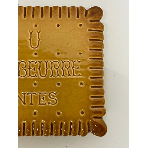 75 - Ceramic advertising French biscuit shaped promotional platter 25 cm x 20 cm.

This lot is available ... 