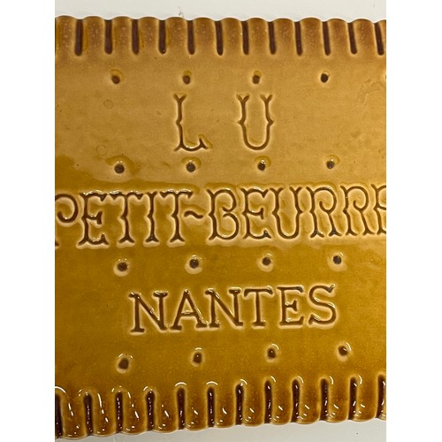 75 - Ceramic advertising French biscuit shaped promotional platter 25 cm x 20 cm.

This lot is available ... 