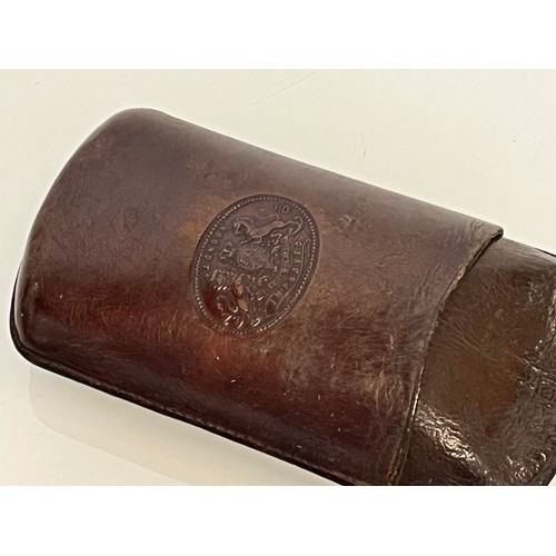 78 - Leather glasses case with embossed royal crest, 15 cm x 8 cm.

This lot is available for in-house sh... 