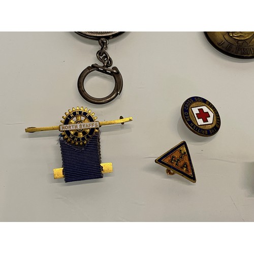 85 - A collection of mixed items, compass, badges, watch fobs etc.

This lot is available for in-house sh... 