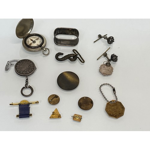 85 - A collection of mixed items, compass, badges, watch fobs etc.

This lot is available for in-house sh... 