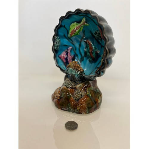 101 - A kitsch ceramic bedside Shell form lamp body filled with tropical fish.

This lot is available for ... 