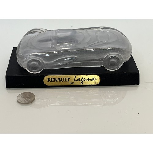 103 - Glass model of a concept car. 20 cm long.

This lot is available for in-house shipping