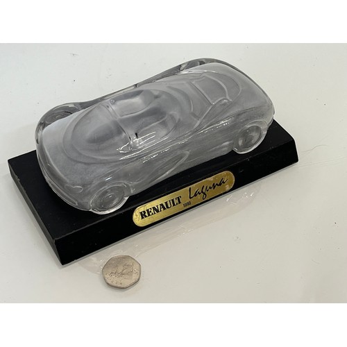 103 - Glass model of a concept car. 20 cm long.

This lot is available for in-house shipping