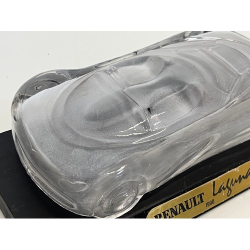 103 - Glass model of a concept car. 20 cm long.

This lot is available for in-house shipping