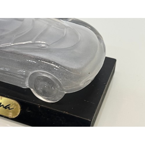 103 - Glass model of a concept car. 20 cm long.

This lot is available for in-house shipping