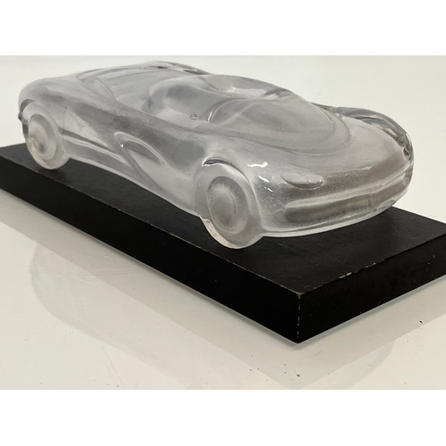 103 - Glass model of a concept car. 20 cm long.

This lot is available for in-house shipping