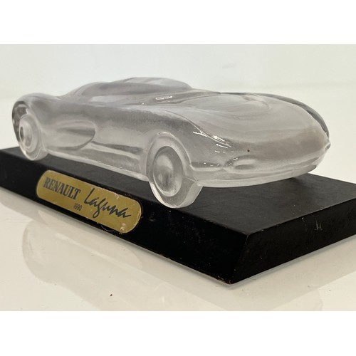 103 - Glass model of a concept car. 20 cm long.

This lot is available for in-house shipping