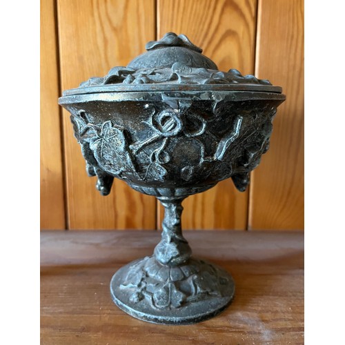 395 - Cast lidded pot decorated with vines and grapes.

This lot is available for in-house shipping