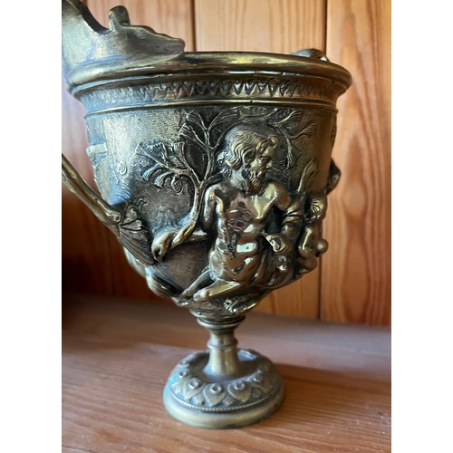 396 - A heavily cast brass twin handled vase decorated with classical figures.

This lot is available for ... 