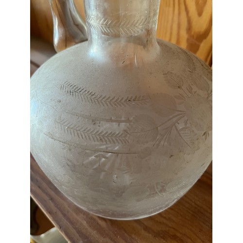 399 - A decanter with wheel cut decoration.

This lot is available for in-house shipping