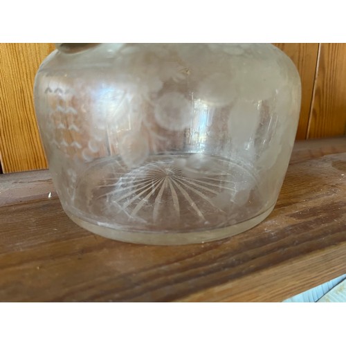 399 - A decanter with wheel cut decoration.

This lot is available for in-house shipping