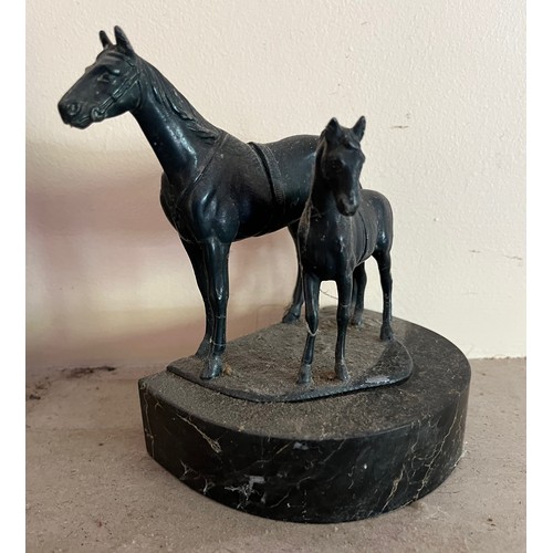 404 - Cast bronzed horse figures of a mother and foal on a marble base.

This lot is available for in-hous... 