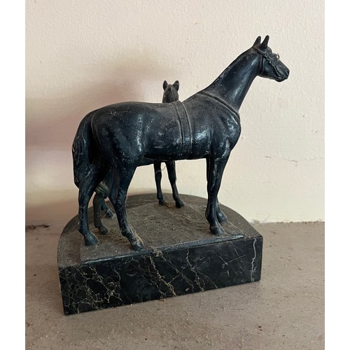 404 - Cast bronzed horse figures of a mother and foal on a marble base.

This lot is available for in-hous... 