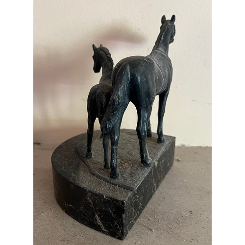 404 - Cast bronzed horse figures of a mother and foal on a marble base.

This lot is available for in-hous... 