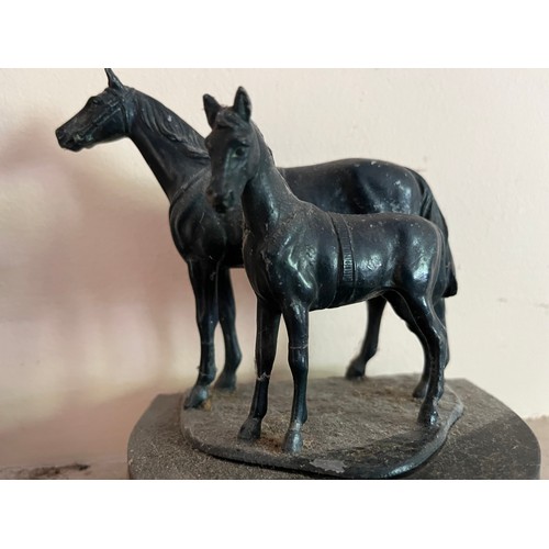 404 - Cast bronzed horse figures of a mother and foal on a marble base.

This lot is available for in-hous... 