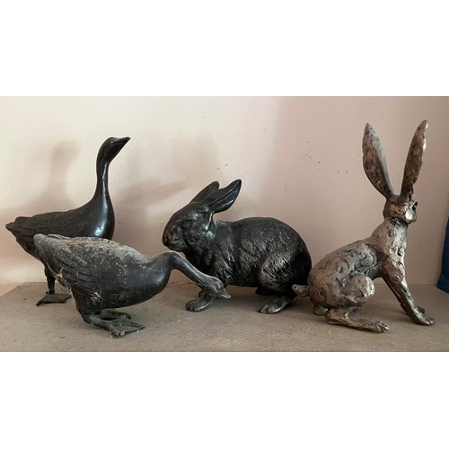 405 - Two cast Geese and a Rabbit and a Hare, Rabbit has damage to an ear.

This lot is available for in-h... 