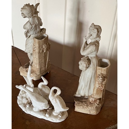 411 - A pair of classical Parian ware figures and a group of ducks.

This lot is available for in-house sh... 