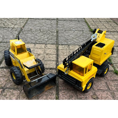 414 - A large Tonka earth mover and a Tonka crane.

This lot is available for in-house shipping