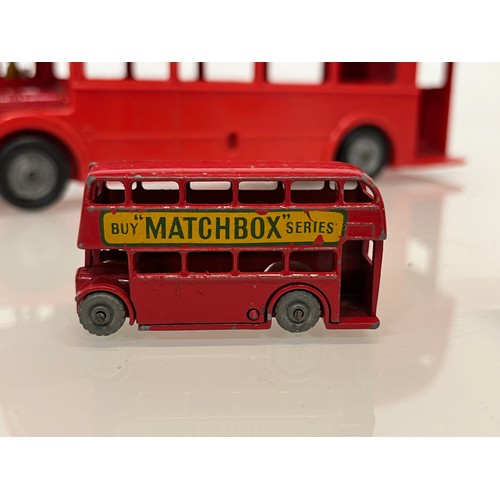 446 - Two diecast Matchbox toy buses and a large plastic Mettoy model of a London Routemaster Bus. 

This ... 