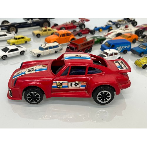 450 - A collection of diecast toy cars and racing cars.

This lot is available for in-house shipping