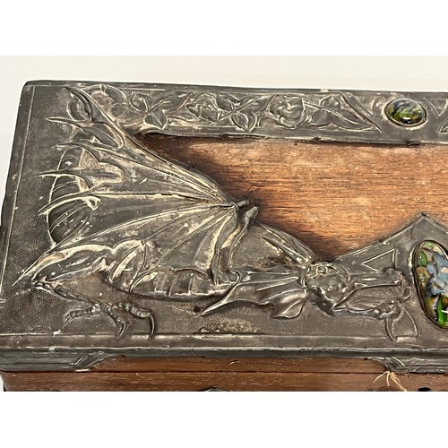 459 - A wooden box with metal bindings decorated with Caboshons, Dragons and embossed flowers. 

This lot ... 