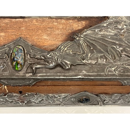 459 - A wooden box with metal bindings decorated with Caboshons, Dragons and embossed flowers. 

This lot ... 