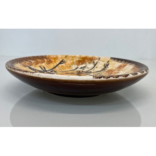 465 - Studio art pottery dish decorated with cave like drawings of deer, 26 cm x 5cm deep.

This lot is av... 