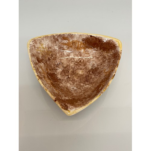 466 - Art pottery triangular shaped dish marked GS to the base, 24 cm and 7 cm deep

This lot is available... 