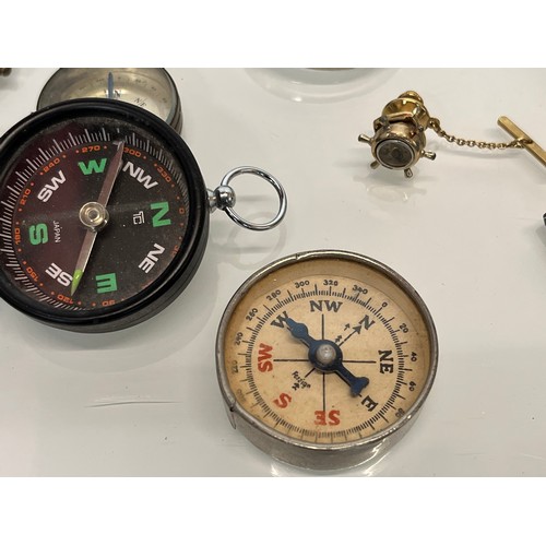 483 - A collection of pocket compasses.

This lot is available for in-house shipping.