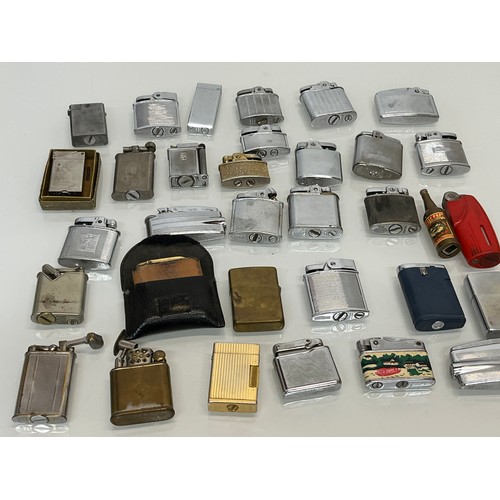 485 - A collection of pocket cigarette lighters, 33 in all.

This lot is available for in-house shipping.