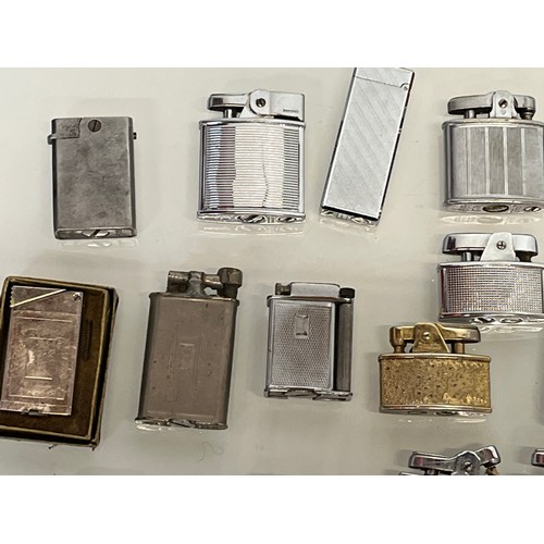 485 - A collection of pocket cigarette lighters, 33 in all.

This lot is available for in-house shipping.