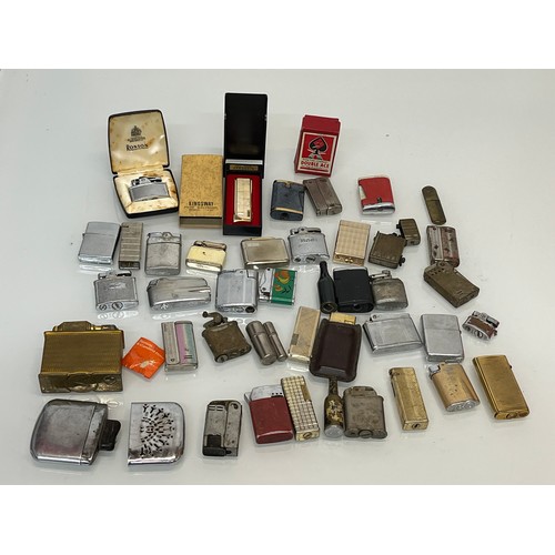 486 - A collection of pocket and table cigarette lighters some in original packaging, 44 in all.

This lot... 