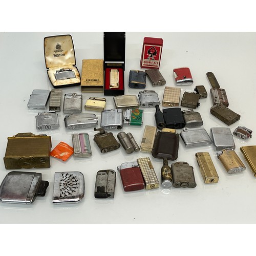 486 - A collection of pocket and table cigarette lighters some in original packaging, 44 in all.

This lot... 