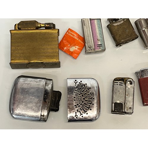 486 - A collection of pocket and table cigarette lighters some in original packaging, 44 in all.

This lot... 